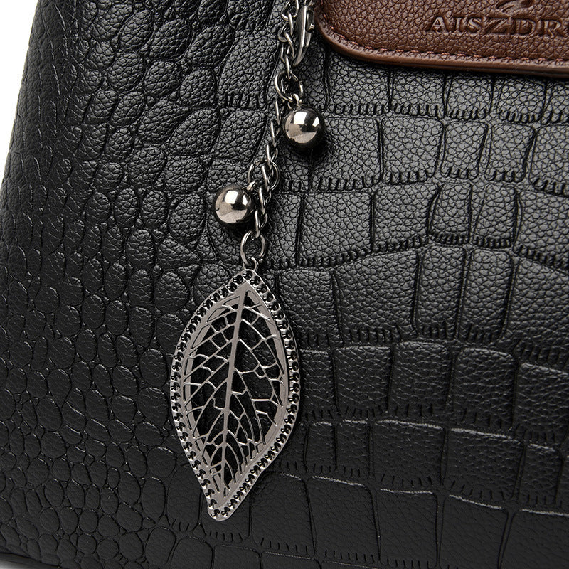 Croc-embossed leather shoulder bag with braided top handle
