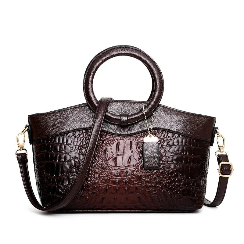 Croc-embossed leather satchel with top handles and crossbody strap