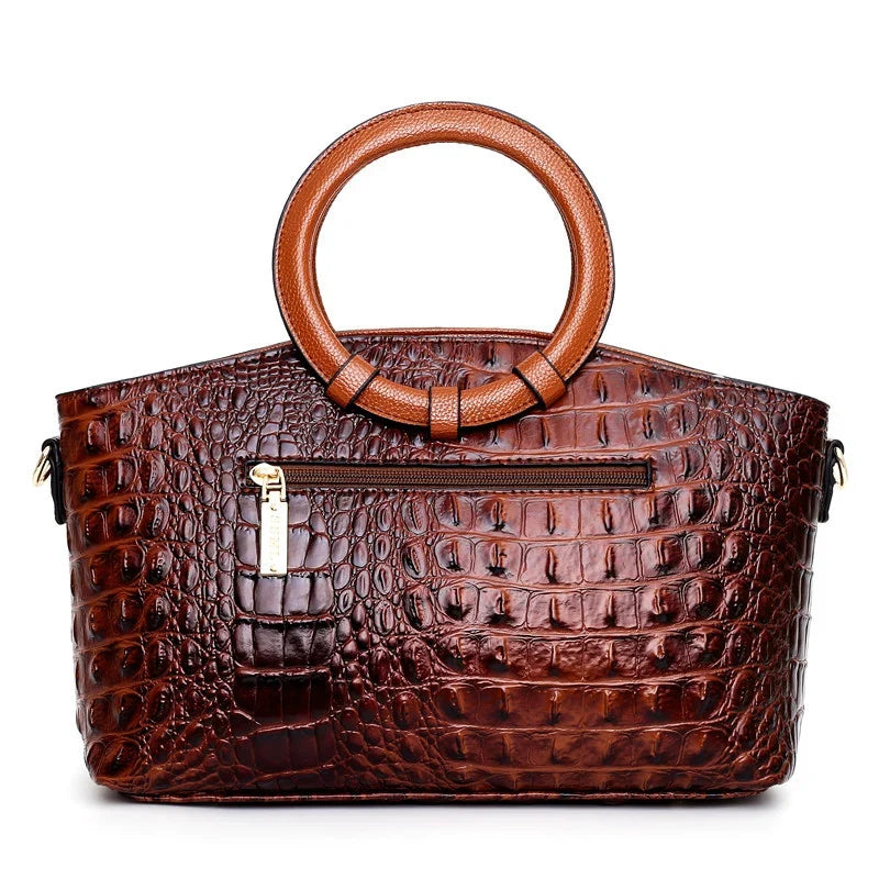 Croc-embossed leather satchel with top handles and crossbody strap