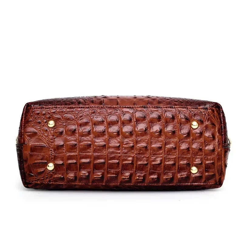 Croc-embossed leather satchel with top handles and crossbody strap