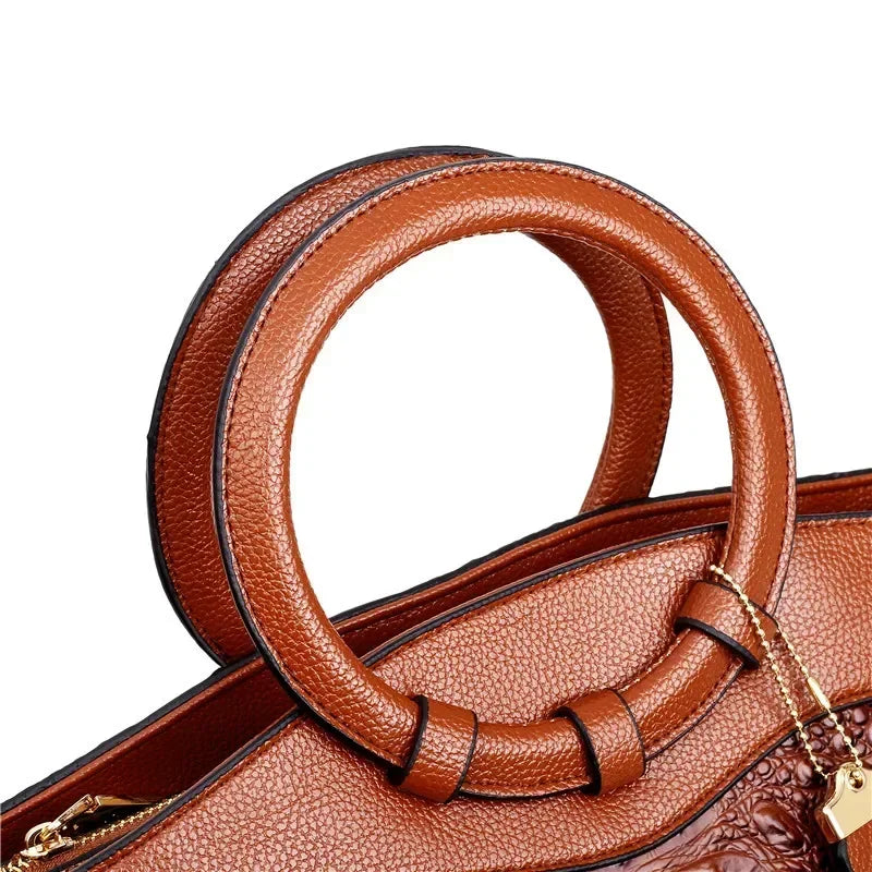 Croc-embossed leather satchel with top handles and crossbody strap