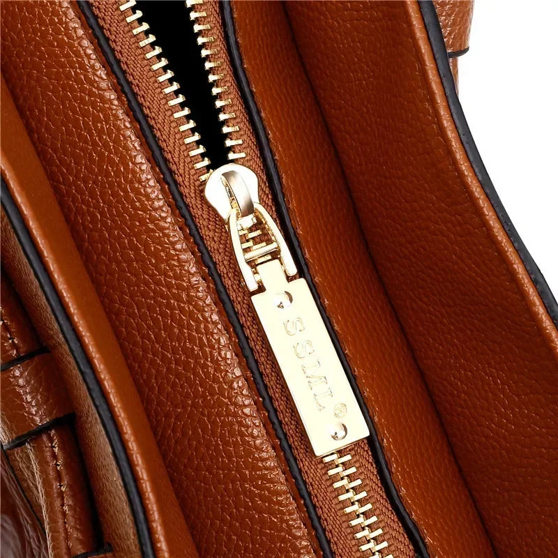 Croc-embossed leather satchel with top handles and crossbody strap