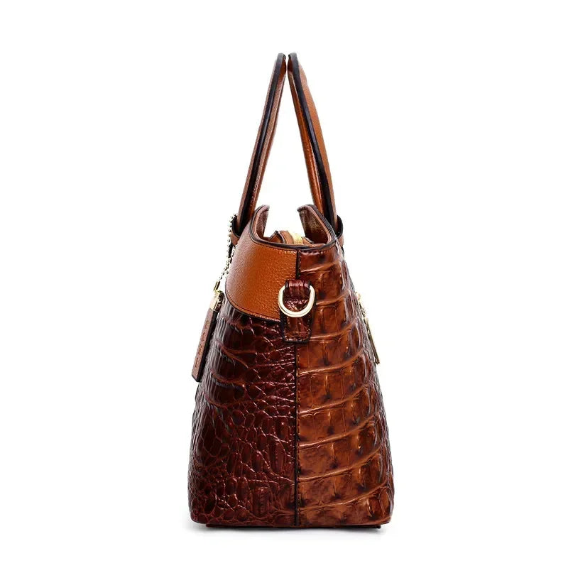 Croc-embossed leather satchel with top handles and crossbody strap